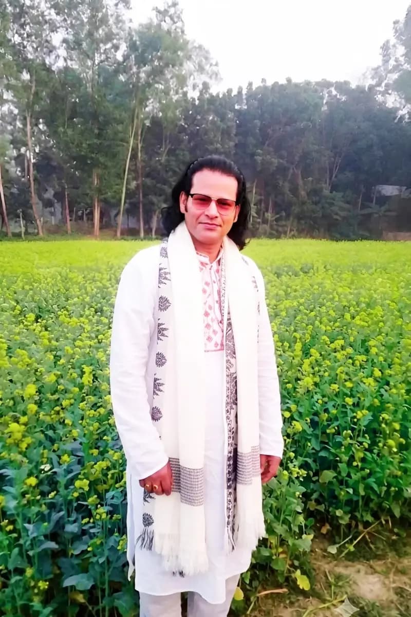 Traditional Bangladeshi Baul Singer Playing Violin In Mustard Field